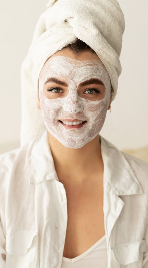 beautiful-woman-applying-facial-mask.jpg